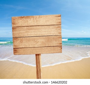 Wood Road Sign On Sea Beach