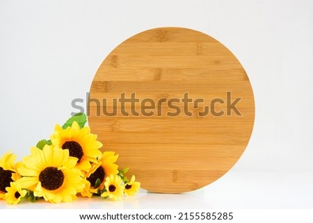 Wood round sign rustic mockup with bouquet of sunflowers on white background, cottagecore aesthetic.