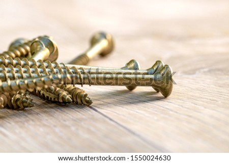 Wood screws on a wooden background - Image 