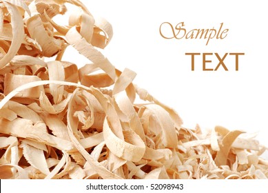 Wood shavings on white background with copy space.  Macro with shallow dof.