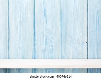 Wood Shelf In Front Of Wooden Wall. View With Copy Space