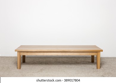 A Wood Side Table On The Ivory Carpet, White Background.