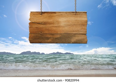 Wood Sign Hanging On Beach