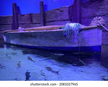 Wood Skiff Tied At Dock with Flemish Coil Beside Cleat. - Powered by Shutterstock