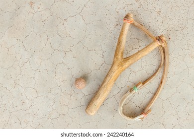 Wood slingshot or wood catapult on concrete background