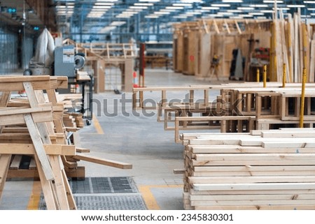 Wood stacked on shelving inside a lumber yard. High quality photo