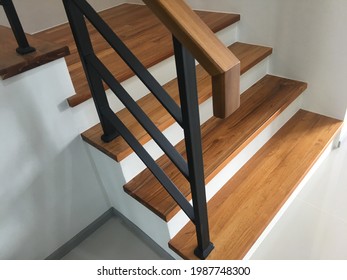 wood stair with black steel railing