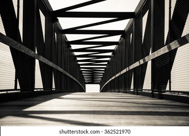 Wood And Steel Foot Bridge In Black And White, Low Point Of View.