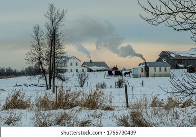 Wood Stove Smoking On A Cold Winter Morning. Amish Schoolhouse Warming Up 