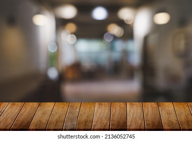 Wood table with blur  in coffee shop cafe For montage product display table copy space cafe background with copy space for text