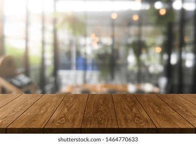 Wood Table In Blurry Background Of Modern Restaurant Room Or Coffee Shop With Empty Copy Space On The Table For Product Display Mockup. Interior Restaurant Counter Design Concept.