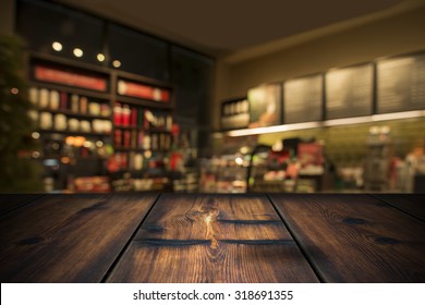 Wood Table With Coffee Shop View In Background
