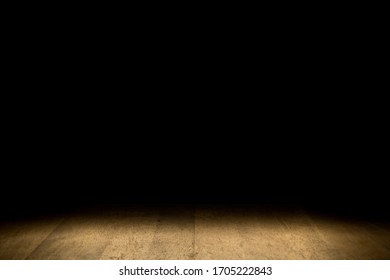 Wood table in the dark background 