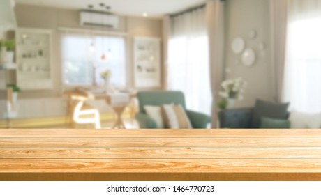 Wood Table In Modern Home Room Interior With Empty Copy Space On The Table For Product Display Mockup. Furniture Design And Home Decoration Concept.