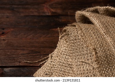 Wood Table With Old Burlap Tablecloth Texture.