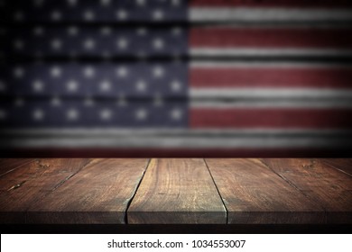 Wood Table On Blurred American Flag Background. 