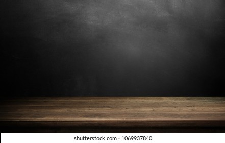 Wood table on dark background. - Shutterstock ID 1069937840