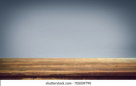Wood table on gradient background.  - Shutterstock ID 705039790
