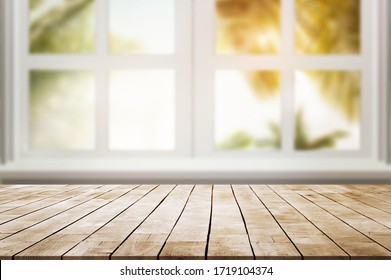 Wood Table Place And Window With  Palm Leaves Against With Sun Light 