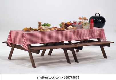 Wood Table And Red Napkin Cover For Outdoor Party Or Picnic In The Garden For Summer Season And White Background In Studio.