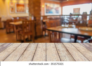 Wood Table With Restaurant Blur Bokeh Background Vintage Tone