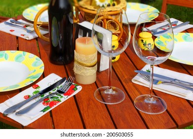 Wood Table Spread For Summer Outdoor Dinning.