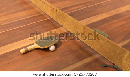 Wood table tennis, two rackets ,a ball and  a leather net.