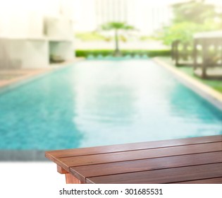 Wood Table Top Of Background And Pool