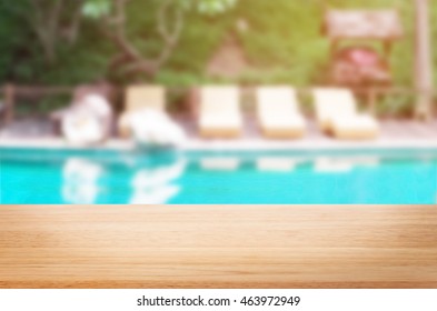 Wood Table Top Background And Swimming Pool.