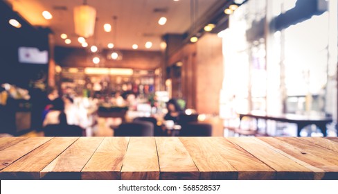 Wood table top with blur of people in coffee shop or (cafe,restaurant )background.For montage product display or design key visual layout - Shutterstock ID 568528537