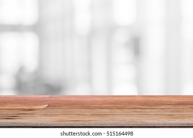 Wood table top and blurred abstract background from interior building - can used for display or montage your products. - Shutterstock ID 515164498