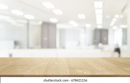 Wood table top and blurred bokeh office interior space background - can used for display or montage your products. - Shutterstock ID 678421156