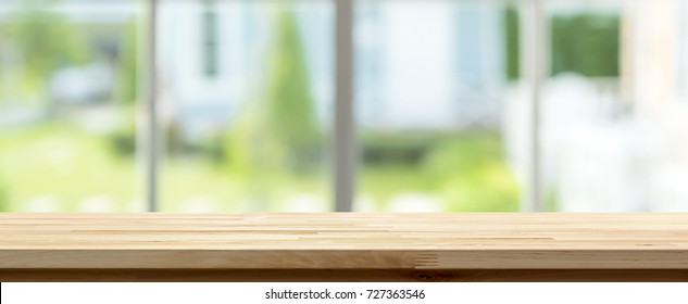 Wood Table Top Inside The House With Blur Green Garden Outside Window In Background, Panoramic Banner - Can Be Used For Display Or Montage Your Products (food)