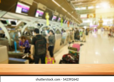 Wood Table Top On Abstract Blur Background Of Counter Checkin At Airport - Can Use To Display Or Montage On Product