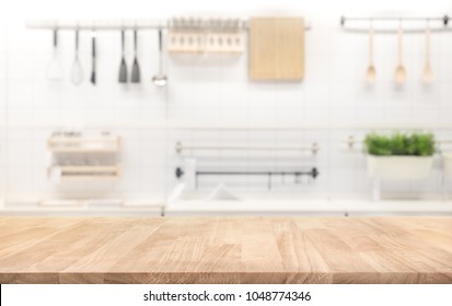 Wood table top on blur kitchen room background .For montage product display or design key visual layout. - Shutterstock ID 1048774346