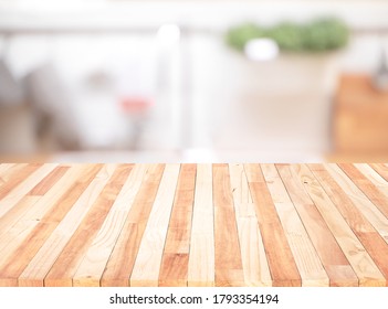 Wood Table Top On Blur Kitchen Counter (room)background.For Montage Product Display Or Design Key Visual Layout.