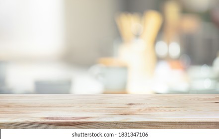 Wood Table Top On Blur Kitchen Counter Background.For Montage Product Display Or Design Key Visual Layout.