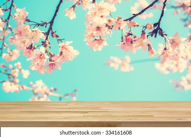 Wood Table Top On Blur Pink Sakura Flower Background, Vintage Tone - Can Be Used For Display Or Montage Your Products