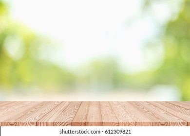 Wood Table Top On Blur Green Abstract Background From Nature - Can Be Used For Display Or Montage Your Products