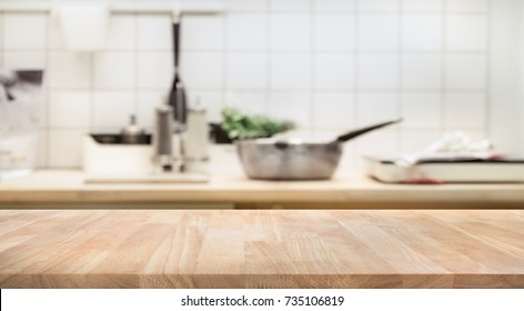 Wood table top on blur kitchen room background .For montage product display or design key visual layout. - Shutterstock ID 735106819