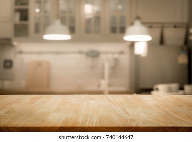 Wood Table Top On Blur Kitchen Room Background .For Montage Product Display Or Design Key Visual Layout.