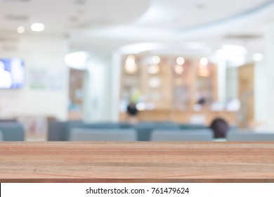 Wood Table Top On Blur People In Hospital Background