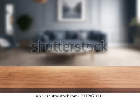 Wood table top on blur living room background, counter background. For Product display