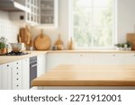 Wood table top on blurred kitchen background.  can be used mock up for montage products display or design layout	