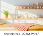 Wood table top on blurred kitchen background. can be used mock up for montage products display or design layout	