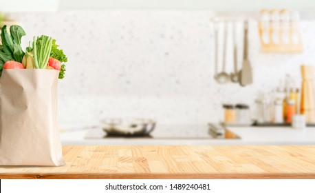 Wood Table Top On Blurred Kitchen Background