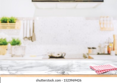 Wood table top on blurred kitchen background - Shutterstock ID 1523969426