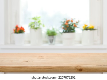 Wood table top on blurred abstract background of window sill