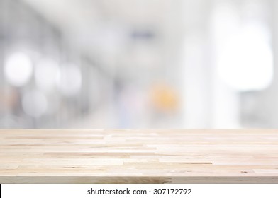 Wood table top on blurred white gray background from hallway - can be used for display or montage your products