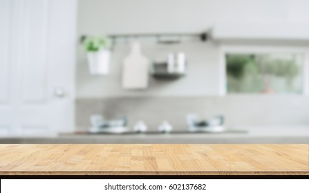 Wood table top on blurred kitchen background, - Shutterstock ID 602137682